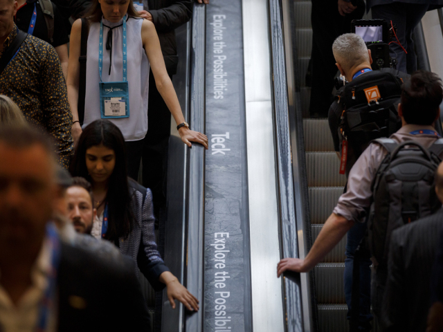 Attendees ride escalators with at the Prospectors & Developers Association of Canada (PDAC) conference in Toronto, on Monday, March 2, 2020.