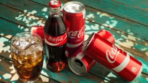 coca-cola (KO) bottles and cans. coke is a blue-chip stocks
