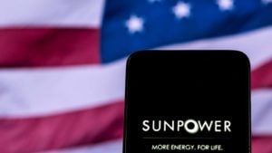 a phone with the sunpower logo in front of a U.S. flag