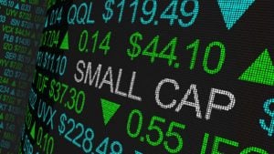 small-cap stocks: a ticker board that says "SMALL CAP" among various ticker increases. represents small-cap stocks to buy. Small-Cap Stocks to Buy and Hold