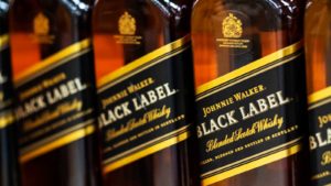 a line up of black label whiskey to represent DEO stock