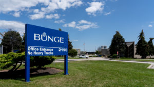 A Photo of a blue sign in an industrial campus showing the Bunge (BG) logo.