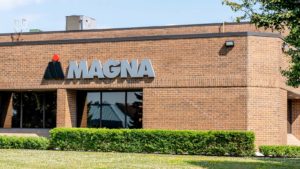 A Magna International (MGA) sign is on the front of a Magna building in Ontario, Canada.