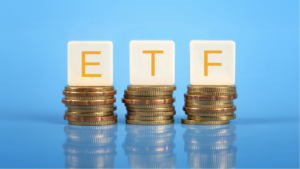 Tiles that say ETF on top of stacks of coins on a blue background