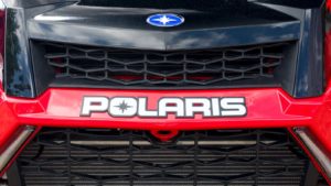A close-up shot of a Polaris (PII) all terrain vehicle.