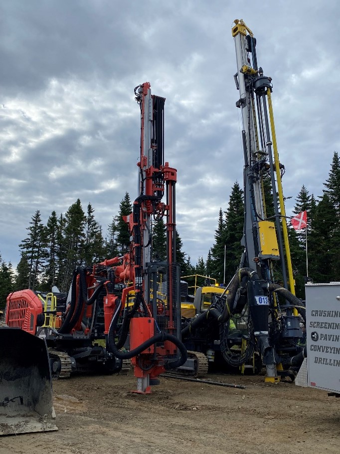 Blasthole drill rigs (left). Commencement of grubbing at permanent camp location (right)