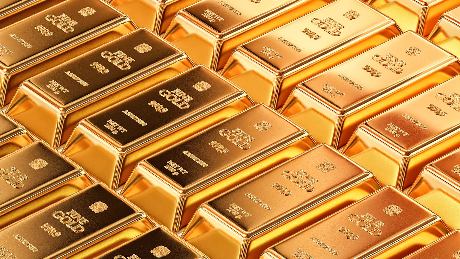 A pile of shining gold bars gold price predictions.
