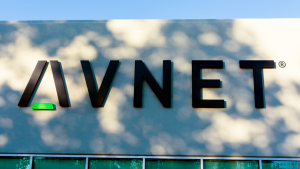 The logo for Avnet (AVT) is seen on the side of a building.